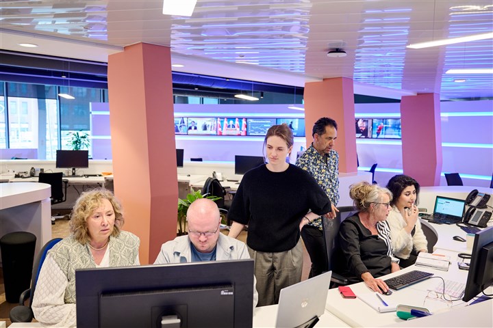Staff members of CBS’s Infoservice and Press Office in the workplace
